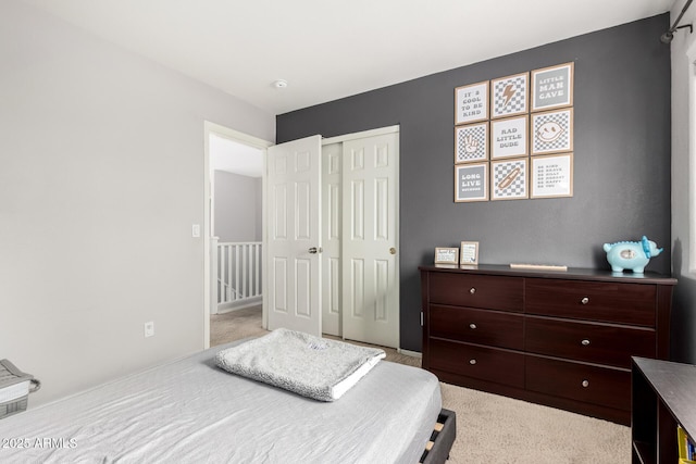 carpeted bedroom featuring a closet