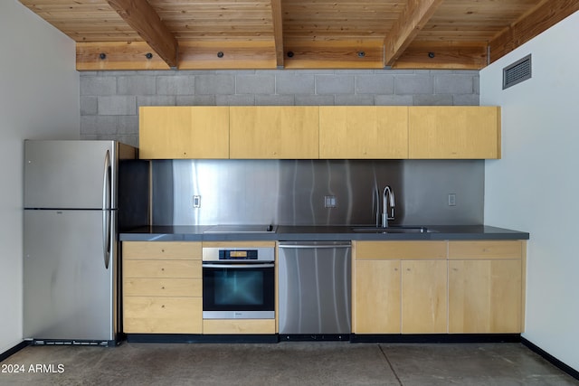 kitchen with appliances with stainless steel finishes, sink, wood ceiling, and beam ceiling