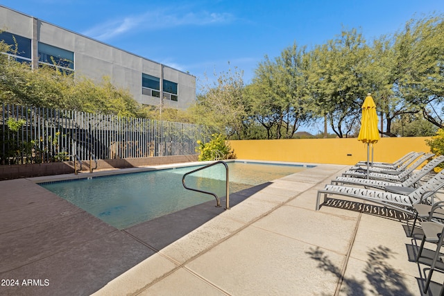 view of swimming pool featuring a patio