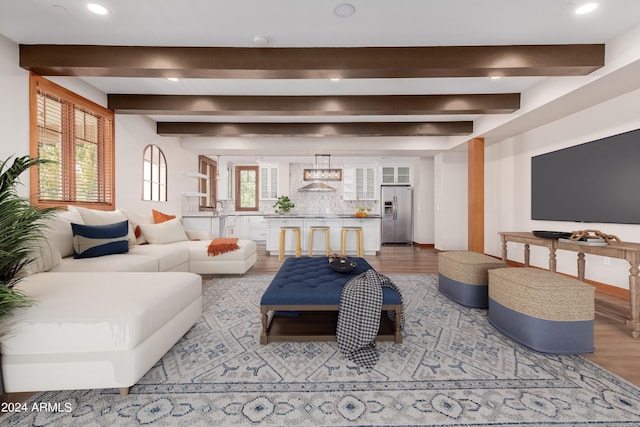 living room with beam ceiling and hardwood / wood-style floors