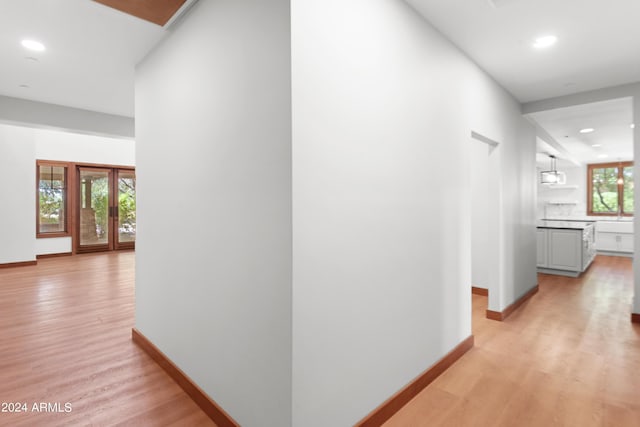 hallway with light wood-type flooring