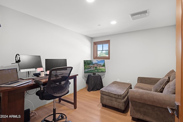 office with light hardwood / wood-style floors