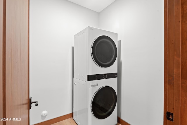 laundry room with stacked washer and dryer