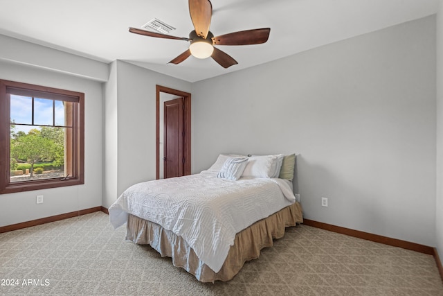 carpeted bedroom featuring ceiling fan