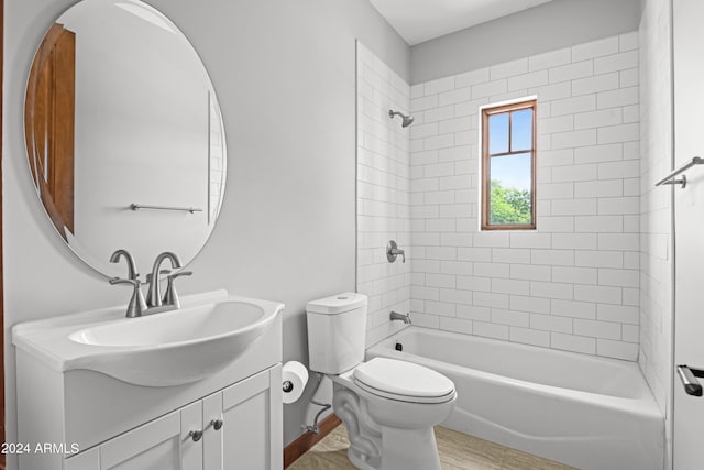 full bathroom with vanity, toilet, and tiled shower / bath