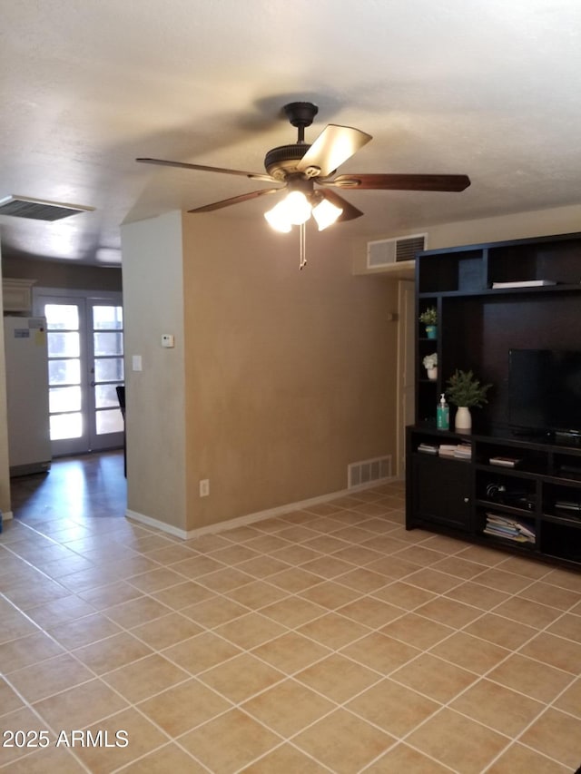 6011 N 33rd Ave, Phoenix, AZ 85017 - unfurnished living room with ceiling fan, baseboards, and light tile patterned flooring