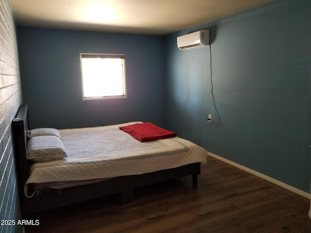 6011 N 33rd Ave, Phoenix, AZ 85017 - bedroom with a wall unit AC and dark wood-style floors
