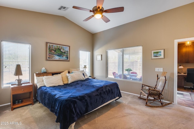 bedroom featuring baseboards, visible vents, light colored carpet, ceiling fan, and vaulted ceiling