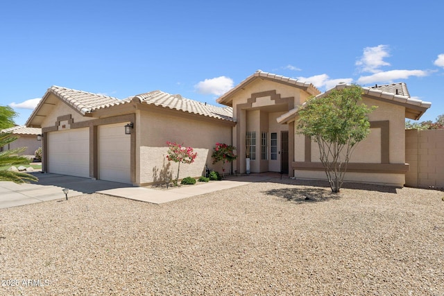 14821 N 42nd St, Phoenix, AZ 85032 - mediterranean / spanish-style home with a tile roof, an attached garage, driveway, and stucco siding