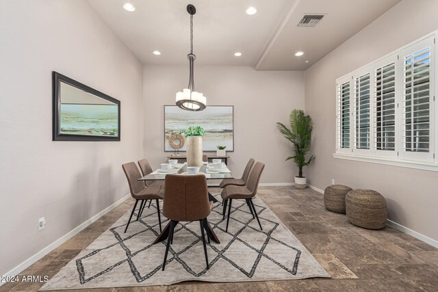 dining area featuring a chandelier