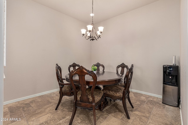 dining area featuring a chandelier