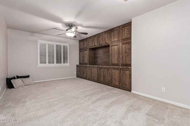 interior space featuring ceiling fan