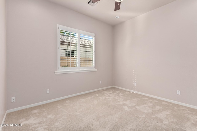 unfurnished room featuring carpet flooring and ceiling fan