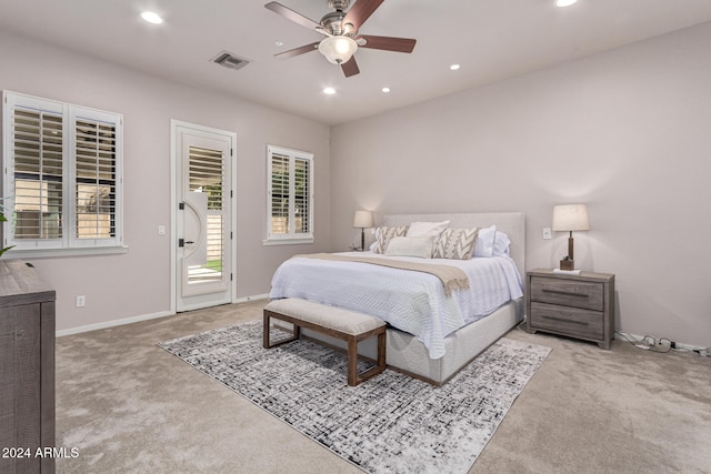 carpeted bedroom featuring access to exterior and ceiling fan