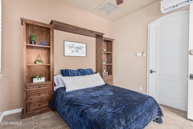 bedroom featuring a wall unit AC