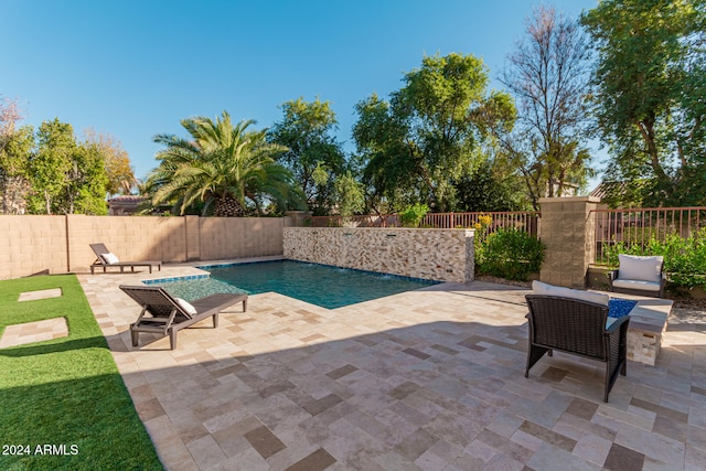 view of pool featuring a patio area