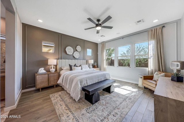 bedroom featuring ceiling fan and hardwood / wood-style floors