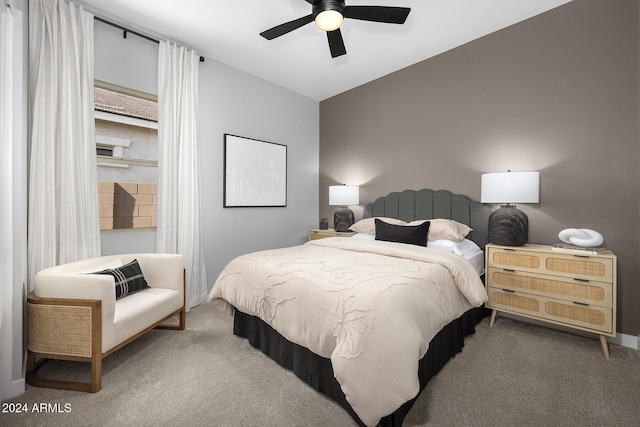 carpeted bedroom featuring vaulted ceiling and ceiling fan