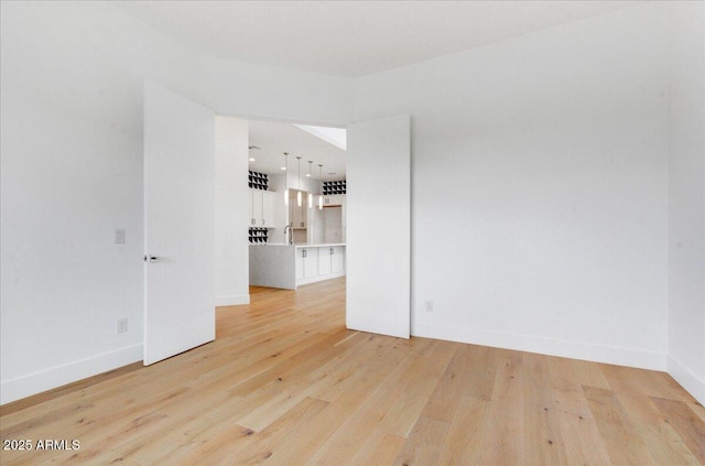 100 W Northern Ave Unit 17, Phoenix, AZ 85021 - unfurnished room featuring light wood finished floors and baseboards