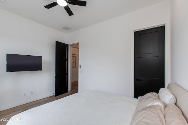 100 W Northern Ave Unit 17, Phoenix, AZ 85021 - bedroom featuring baseboards, visible vents, ceiling fan, and wood finished floors