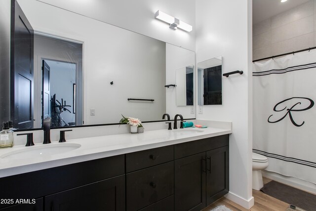 100 W Northern Ave Unit 17, Phoenix, AZ 85021 - full bath with wood finished floors, a sink, toilet, and double vanity