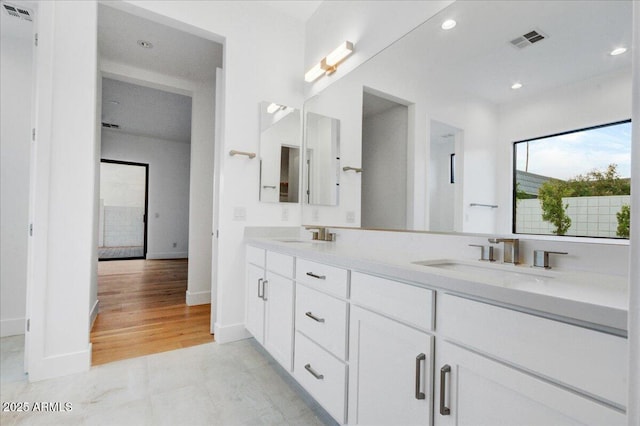 100 W Northern Ave Unit 17, Phoenix, AZ 85021 - bathroom with double vanity, visible vents, a sink, and recessed lighting