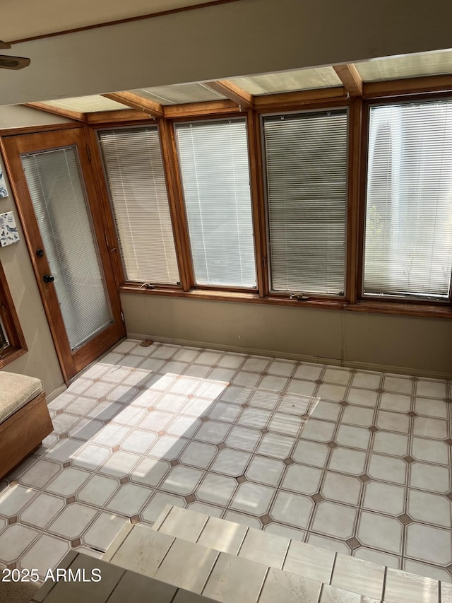 unfurnished room featuring light floors