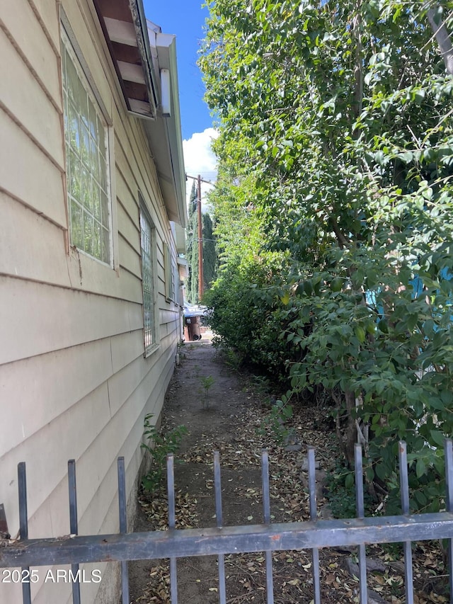 view of property exterior with fence