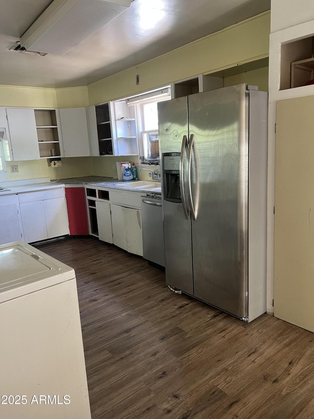 kitchen featuring dark wood-type flooring, open shelves, appliances with stainless steel finishes, and white cabinets