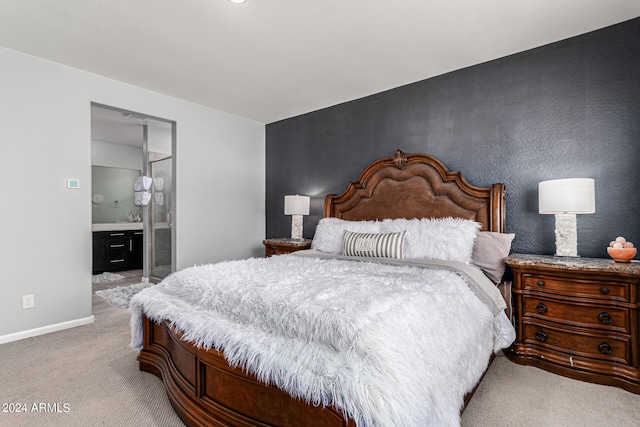 carpeted bedroom featuring connected bathroom