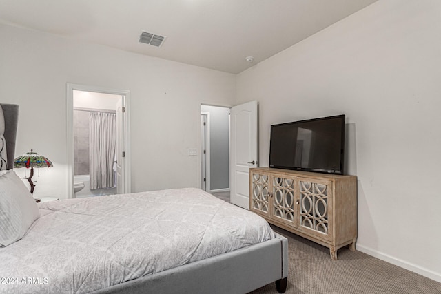 bedroom with carpet floors and ensuite bath