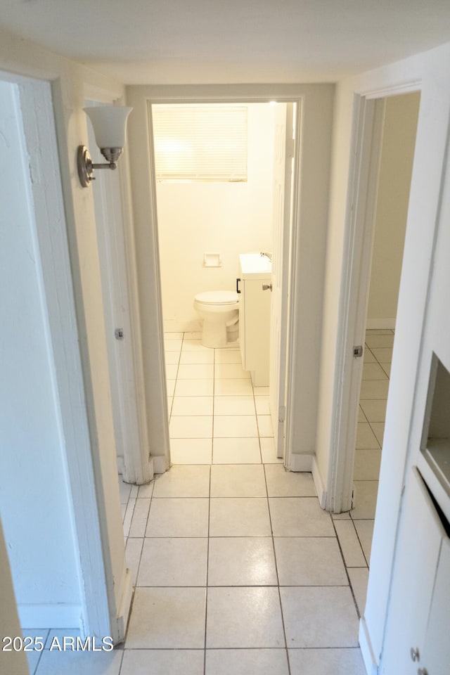 1914 W Colter St, Phoenix, AZ 85015 - hall with light tile patterned floors and a sink