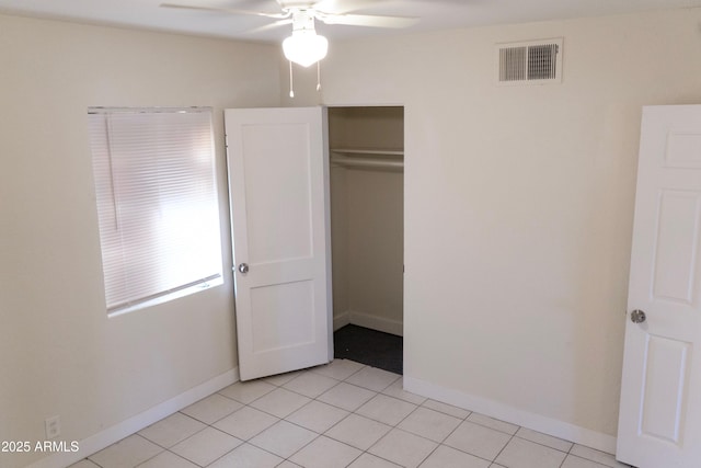 1914 W Colter St, Phoenix, AZ 85015 - unfurnished bedroom with light tile patterned floors, baseboards, a closet, and a ceiling fan