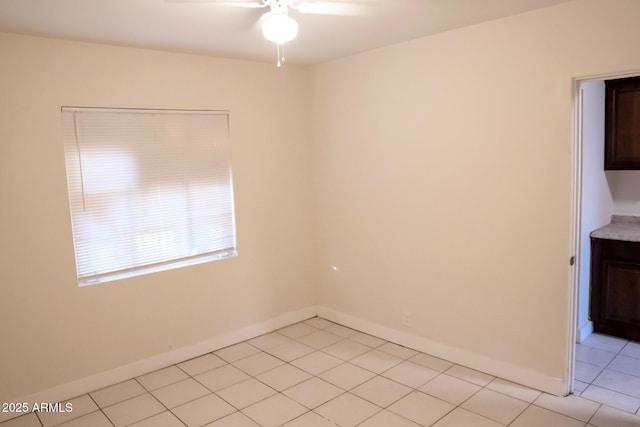 1914 W Colter St, Phoenix, AZ 85015 - spare room with ceiling fan, light tile patterned floors, and baseboards