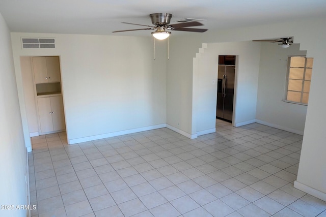 1914 W Colter St, Phoenix, AZ 85015 - unfurnished room with a ceiling fan, baseboards, and light tile patterned floors