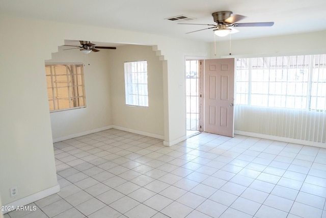1914 W Colter St, Phoenix, AZ 85015 - spare room with a ceiling fan, light tile patterned floors, and baseboards