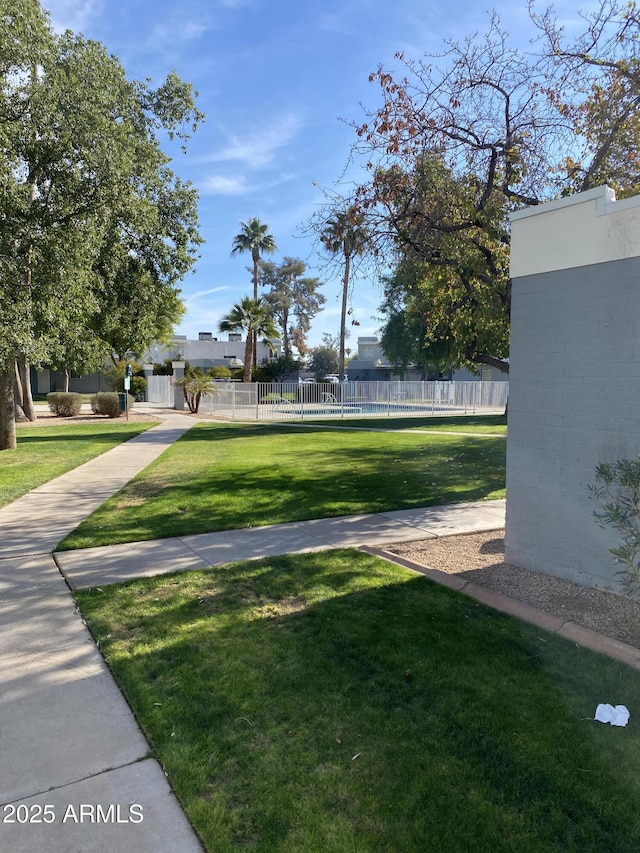 view of community featuring a yard