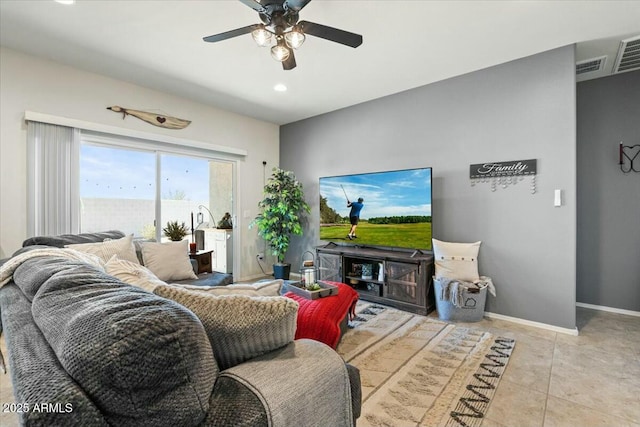 tiled living room featuring ceiling fan