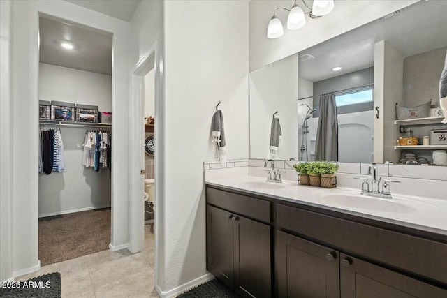 bathroom with tile patterned floors, vanity, and a shower with shower curtain