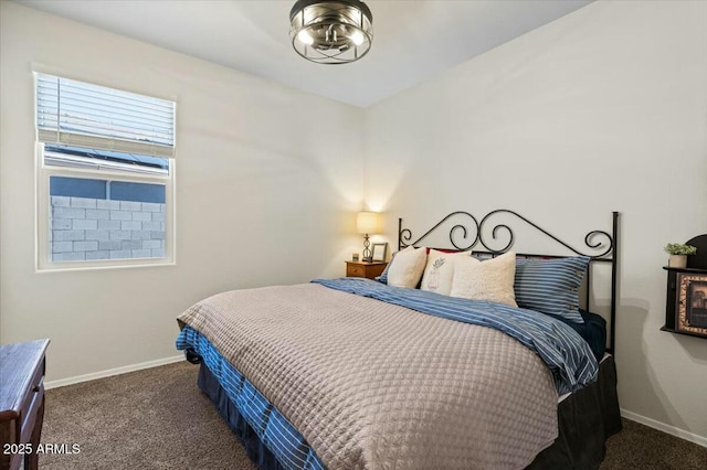 bedroom featuring dark carpet