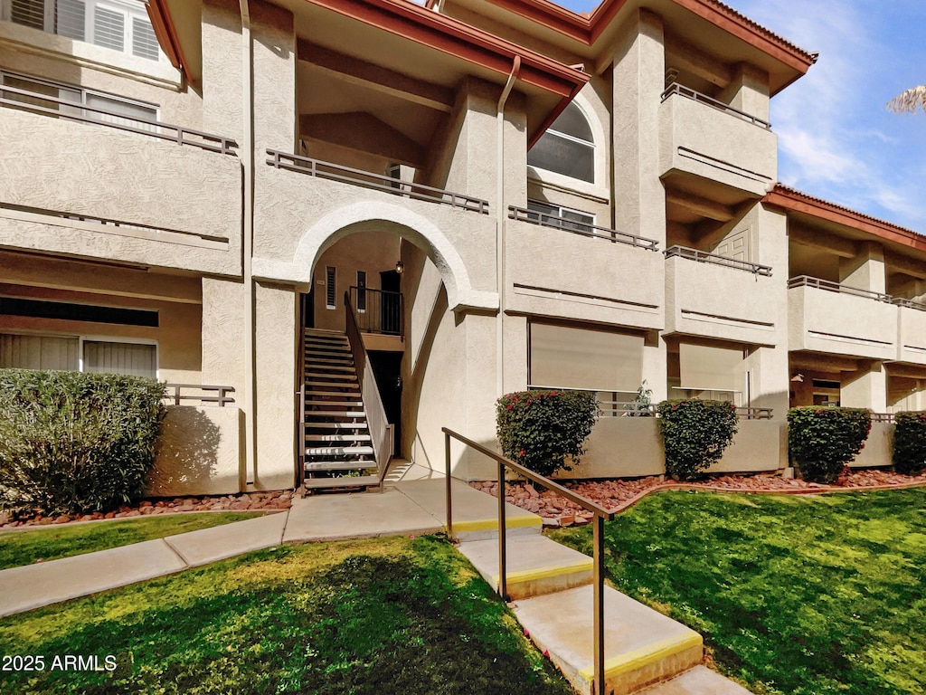 view of property featuring stairway