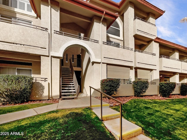 view of property featuring stairway