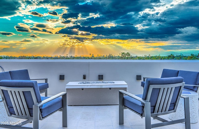 patio terrace at dusk with a fire pit