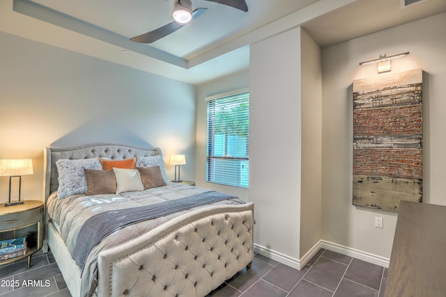 tiled bedroom featuring ceiling fan