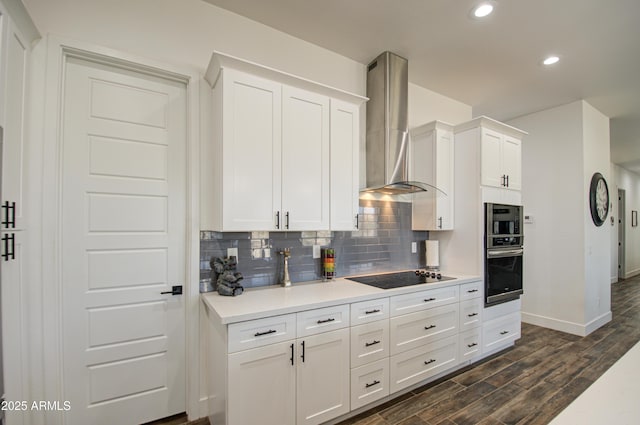 kitchen featuring backsplash, white cabinets, black electric cooktop, and wall chimney exhaust hood