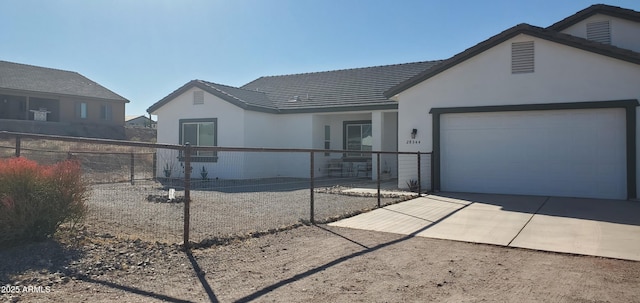 ranch-style home with a garage