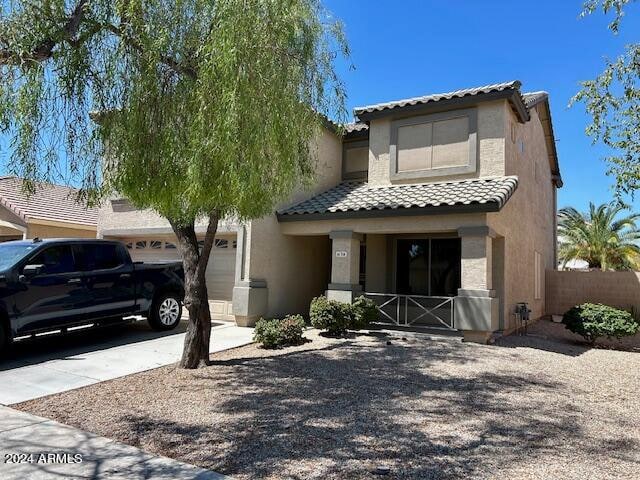 view of front of home with a garage