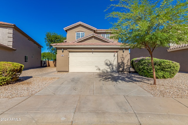 front facade with a garage