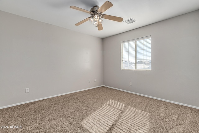 unfurnished room with carpet flooring and ceiling fan