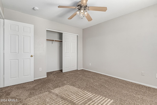 unfurnished bedroom with a closet, ceiling fan, and carpet